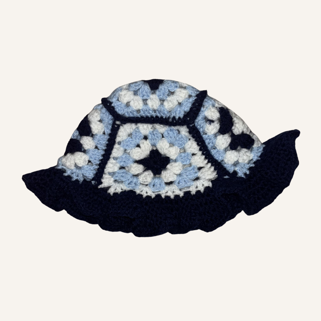 Crocheted hat with a granny square pattern on a white background
