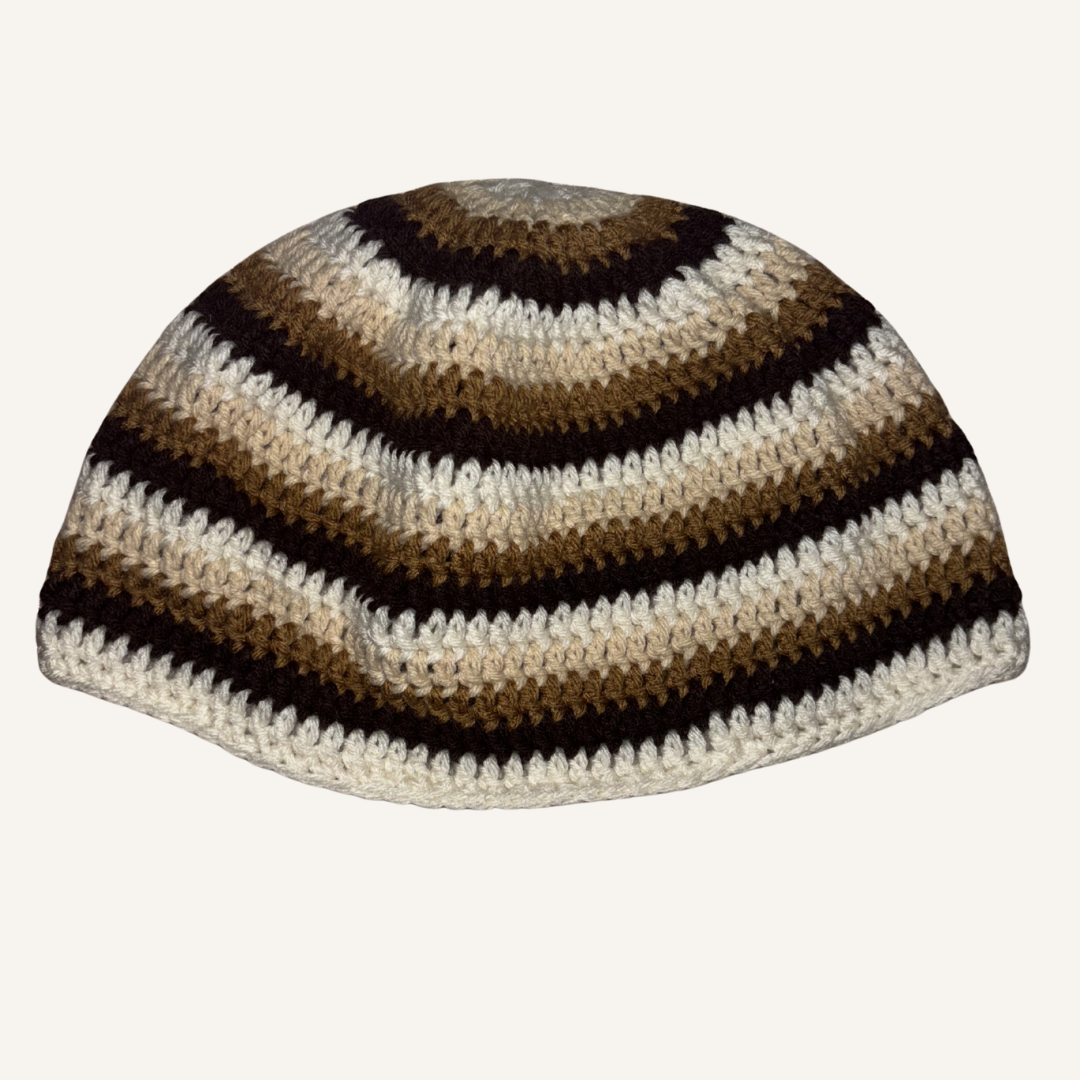 Striped crocheted beanie in brown, beige, and white on a white background