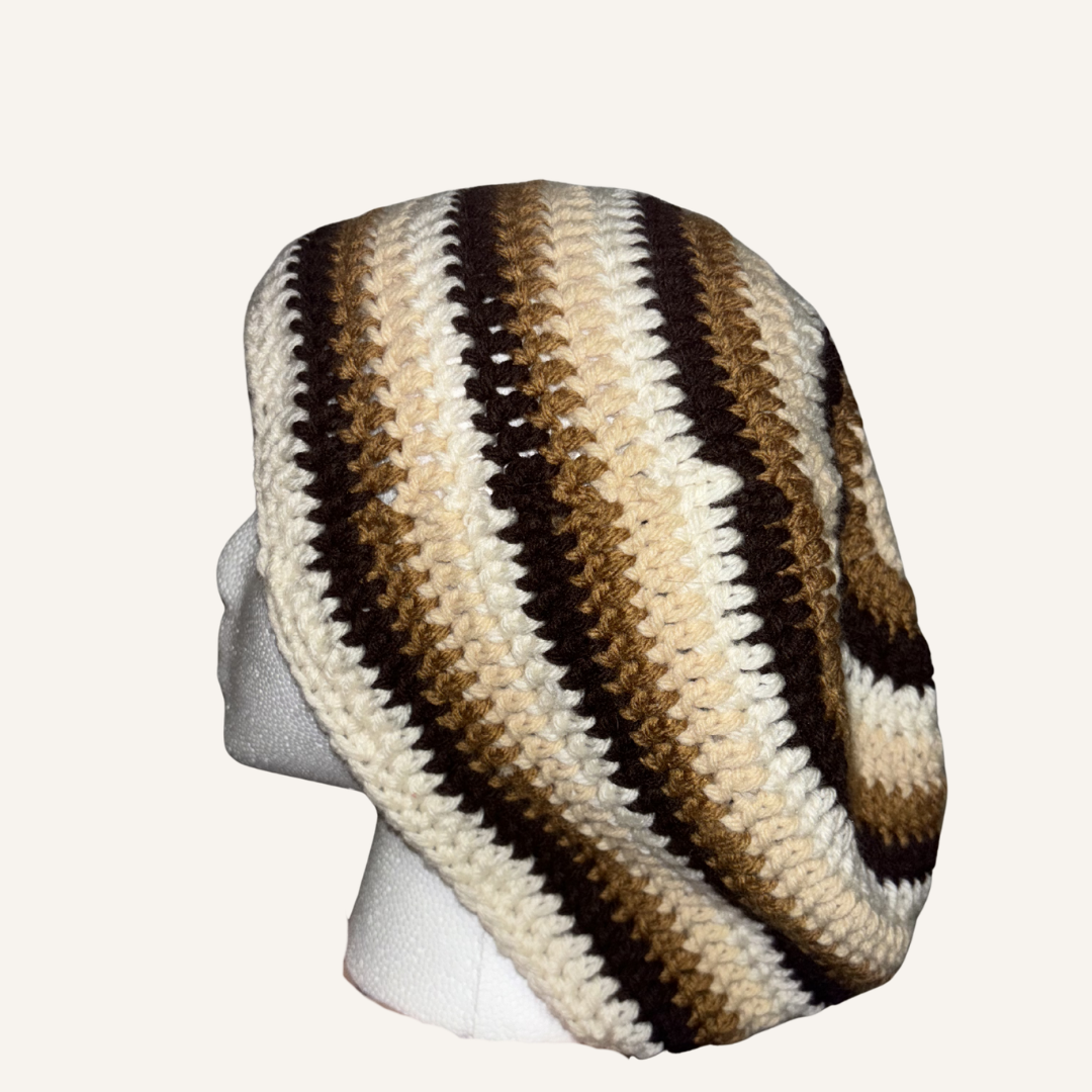 Striped crochet beanie on a mannequin head against a white background